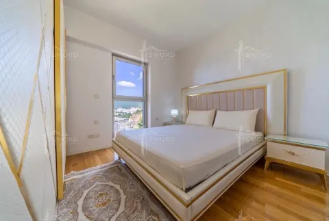 Bright bedroom with a double bed, wardrobe, and a window view. - image 5
