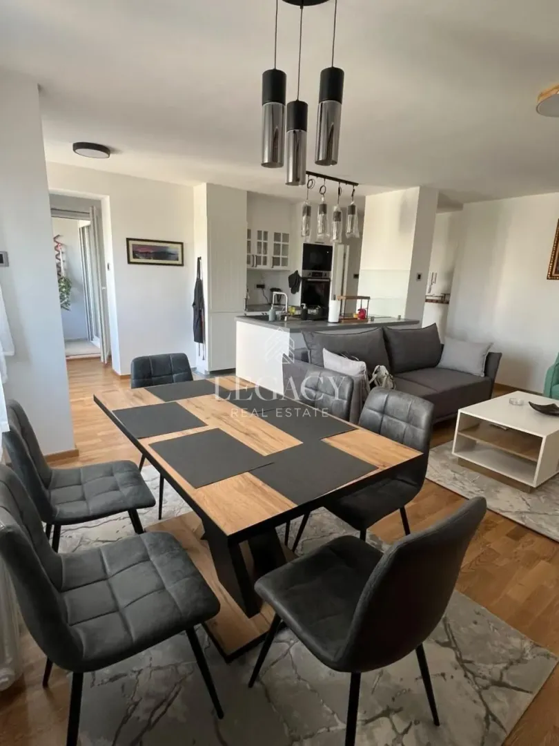 Open-plan living room with dining area and kitchen.