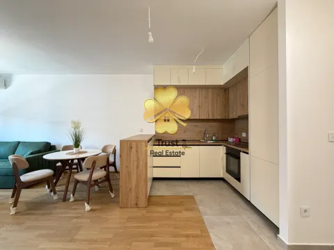 Modern kitchen with a dining area and living room in light tones. - image 6