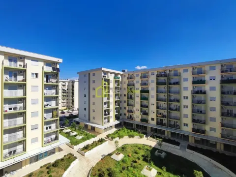 View of the residential building facades and landscaped inner courtyard with greenery. - image 7