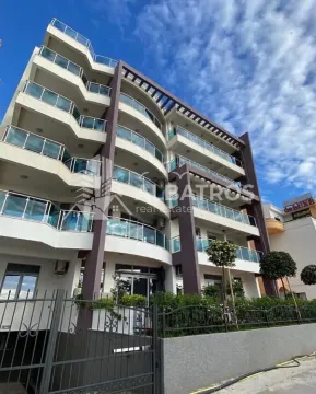 Exterior view of a modern apartment building with terraces. - image 12