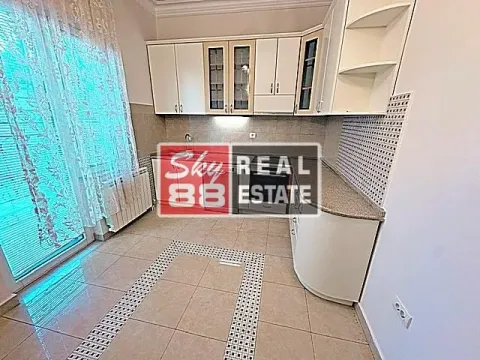 Kitchen with white cabinetry and ceramic floor tiles. - image 4
