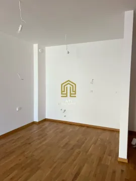 Empty room with hardwood floors and white walls. - image 5