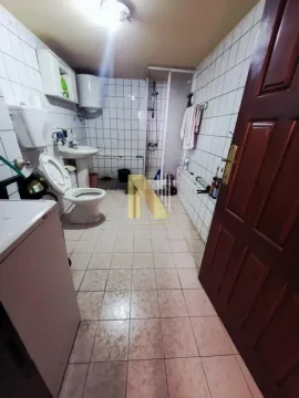 Older furnished bathroom with sanitary fixtures and a shower cabin. - image 9