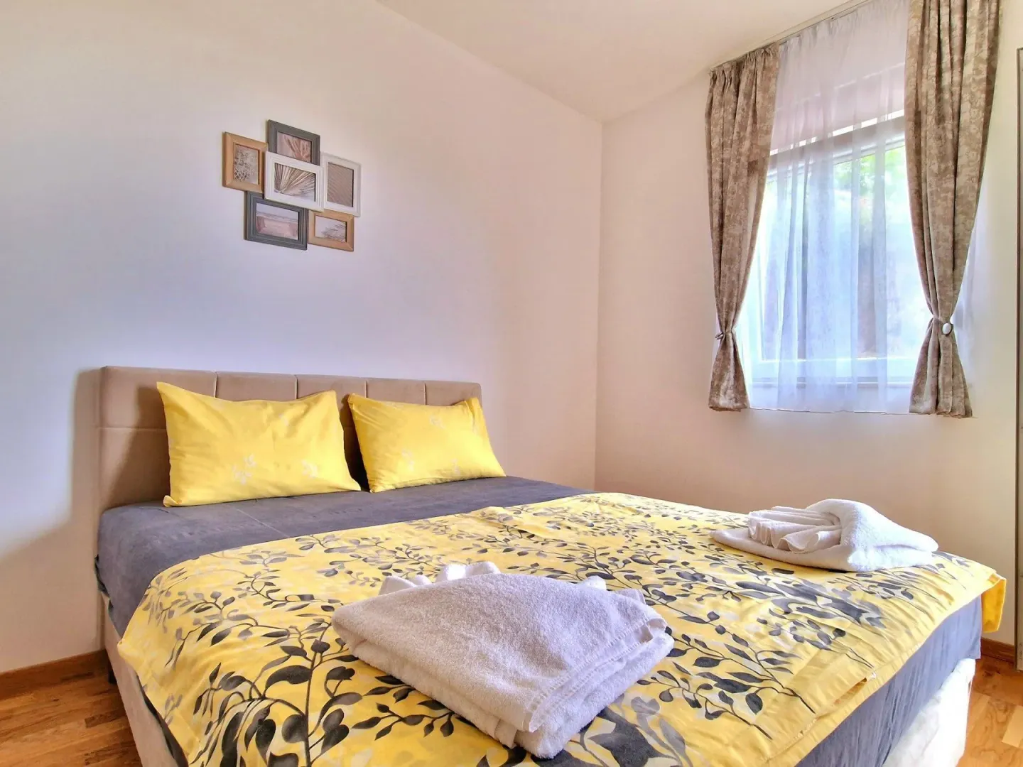 Bedroom with a double bed and a window.