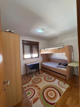 Children's bedroom with a bunk bed, desk, and wardrobe. - image 8