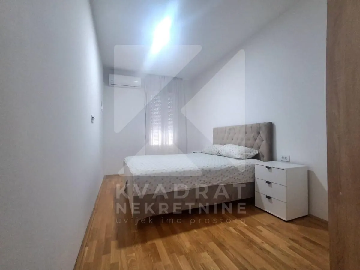 Bedroom with a double bed and a nightstand.