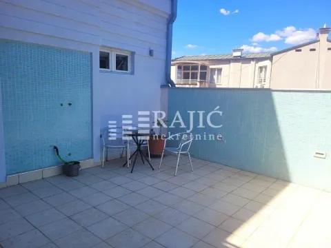 Spacious terrace with tiles and outdoor seating. - image 4