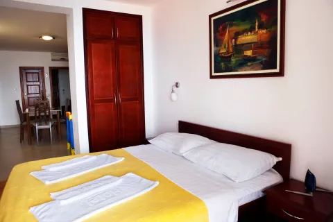 Furnished bedroom with a double bed and a fitted wardrobe. - image 8