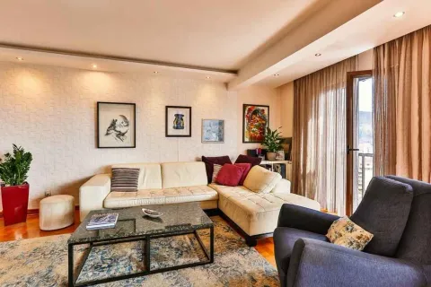 Bright living room with a corner sofa and armchair. - image 12