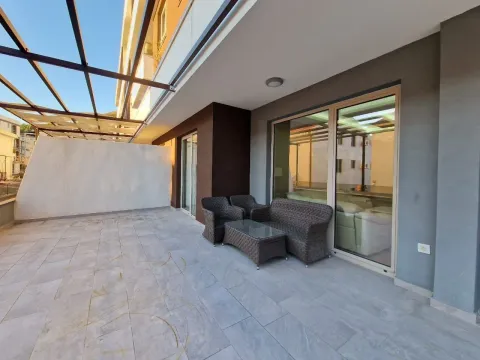 Spacious terrace with outdoor seating furniture and a metal canopy. - image 22