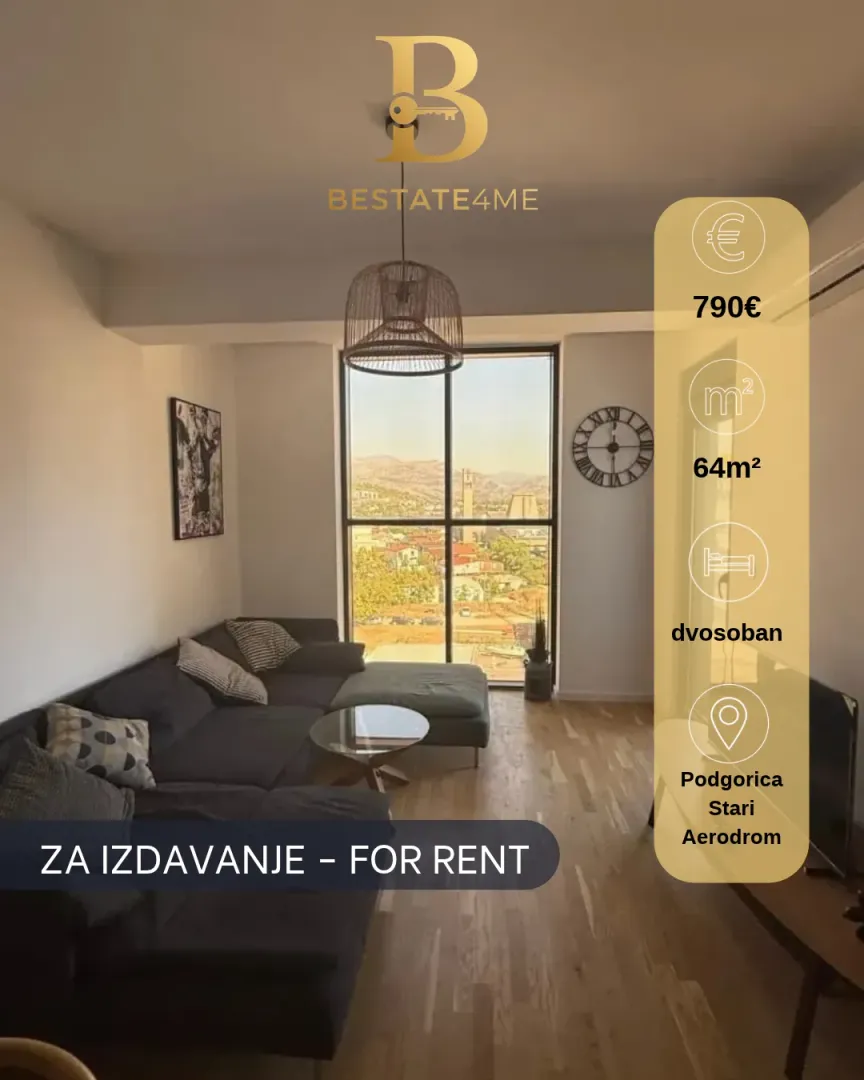 Living room with sofa and large window.