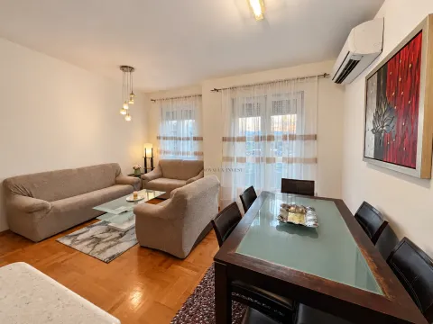 Living room with a sofa set and a dining table. - image 3