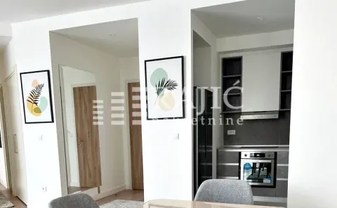 Open-plan living and dining area overlooking the kitchen. - image 4