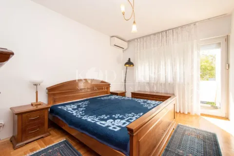 Bedroom with a double bed, bedside tables, and access to the terrace. - image 10
