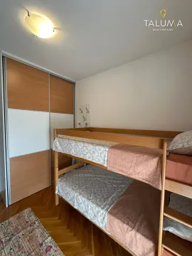 Children's bedroom with a bunk bed and a built-in wardrobe. - image 8