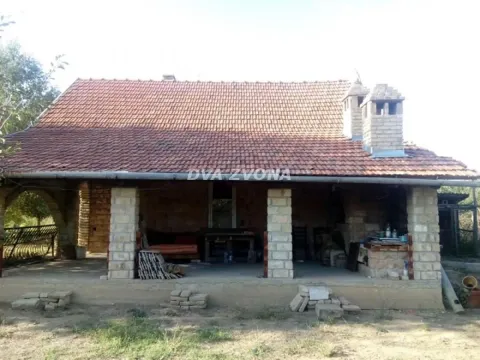 View of the exterior of the house with a covered terrace and stone pillars. - image 4
