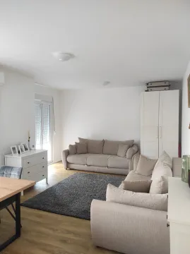 Bright living room with a sofa set and modular furniture. - image 2