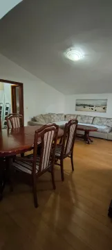 Living room with dining area and sofa set. - image 12