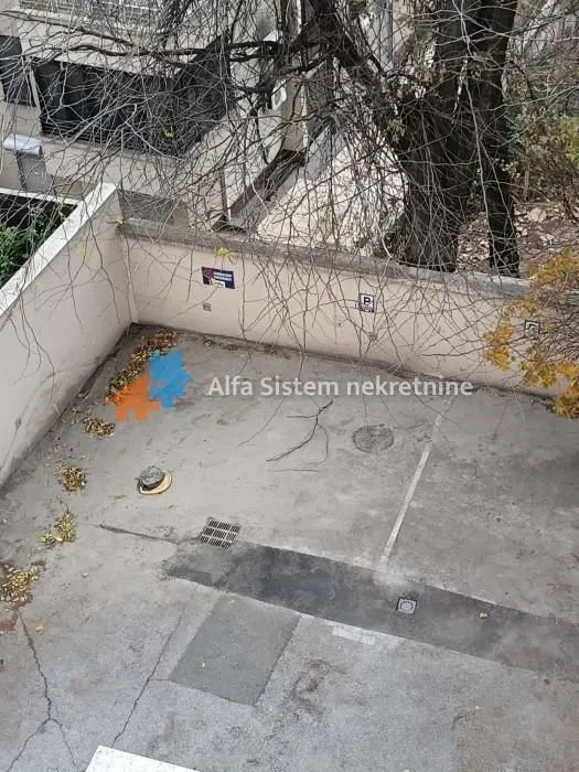 High angle view of the building's parking area and yard.