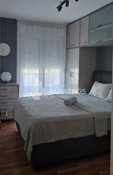 Furnished bedroom with a double bed, wardrobe, and a window. - image 8