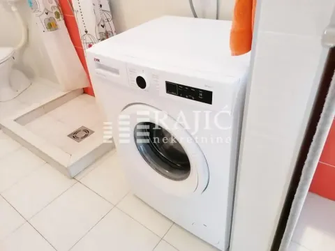Bathroom with a washing machine. - image 20
