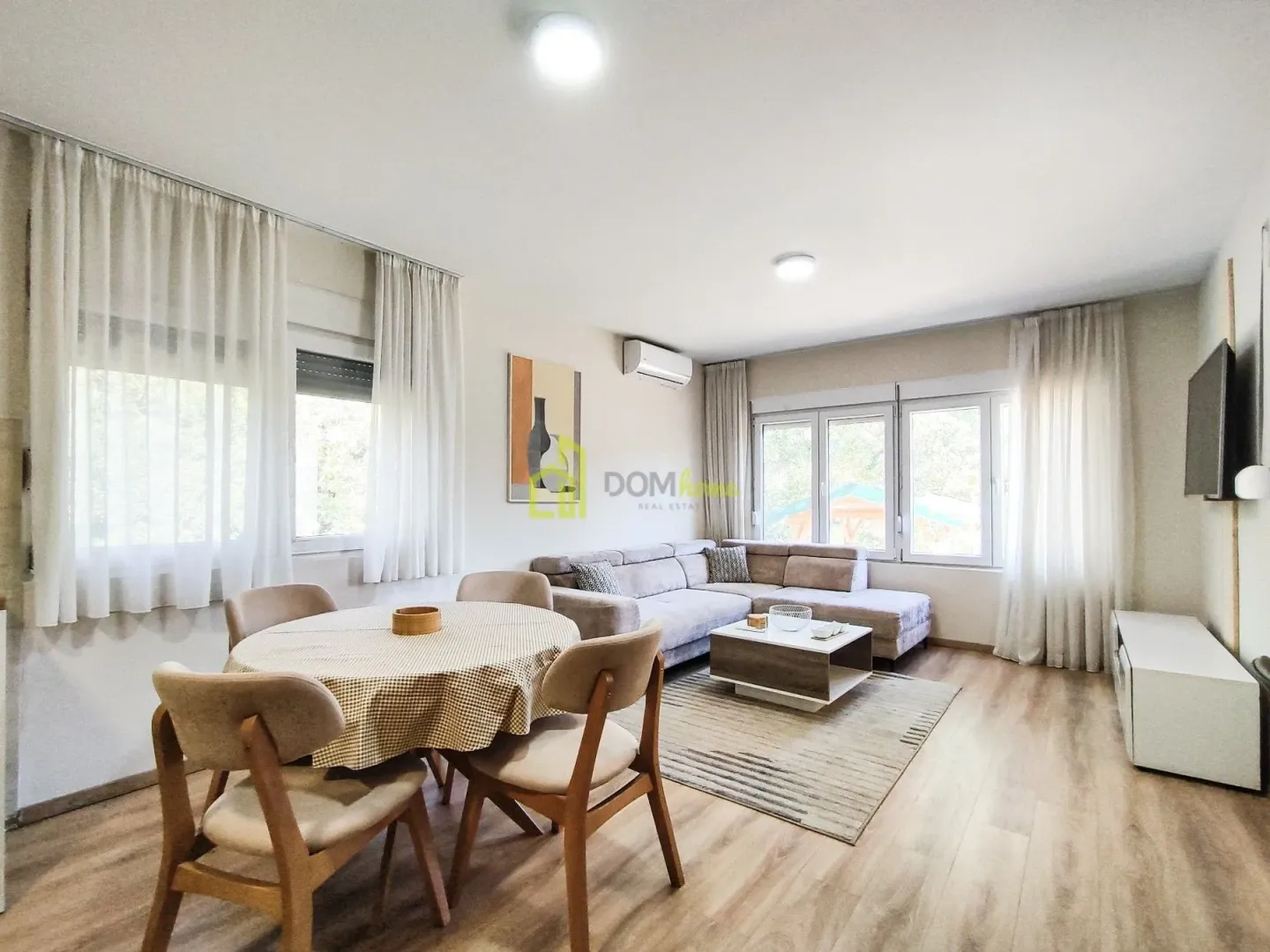 Spacious living room with a dining table and sofa set.