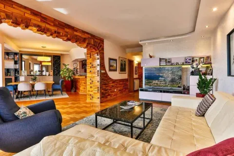 Spacious living room with modern furniture and a decorative wooden arch. - image 15