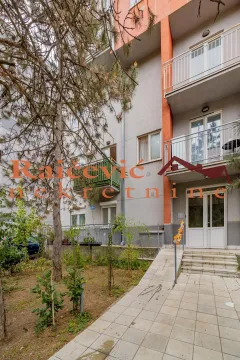 View of the entrance to the residential building with a courtyard. - image 10