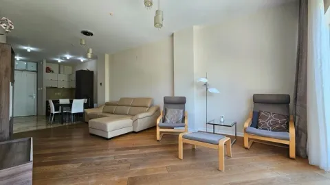 Spacious living room with a sofa set and dining area in the background. - image 3