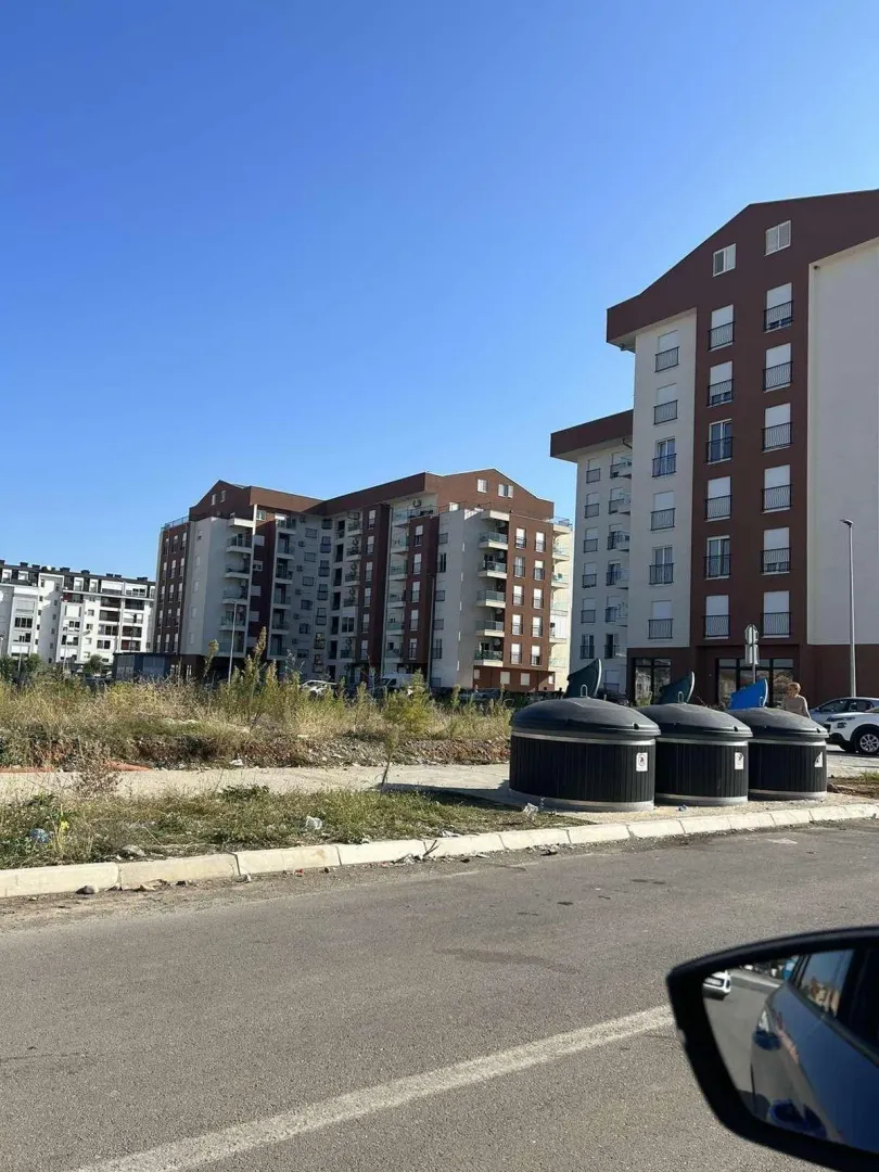 A street-level view of residential buildings and the surrounding area.