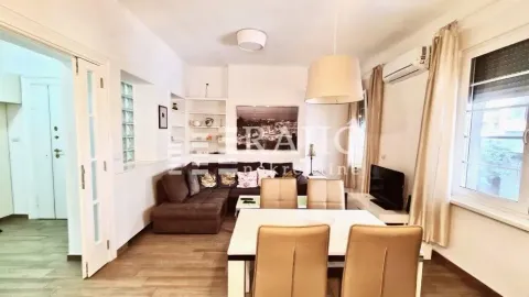 Living room with dining area and seating set. - image 2