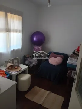 Small room with a bed, small table and various furniture. - image 16