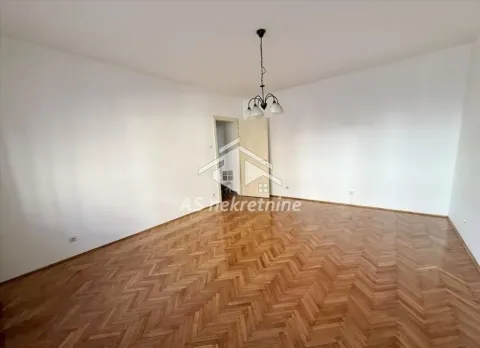 Empty room with parquet flooring and white walls. - image 7