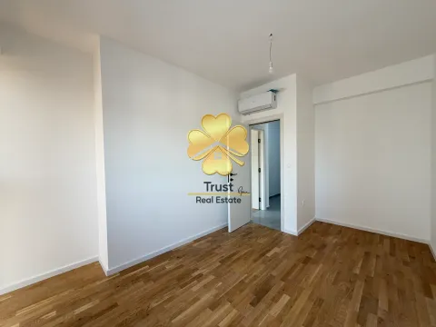 Empty room with hardwood floors and white walls. - image 15