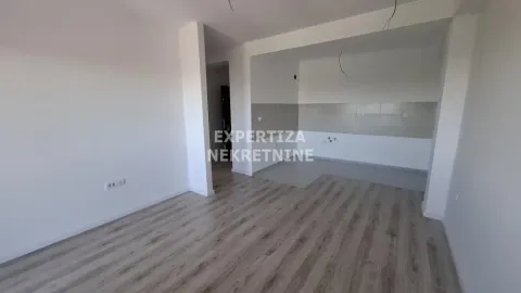 Empty room with wooden flooring and an agency watermark. - image 2
