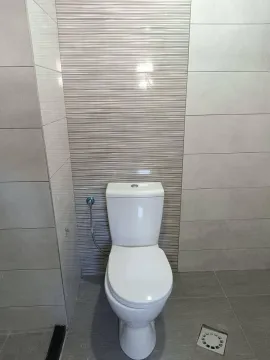 Modern equipped bathroom with ceramic tiles and sanitary ware. - image 6