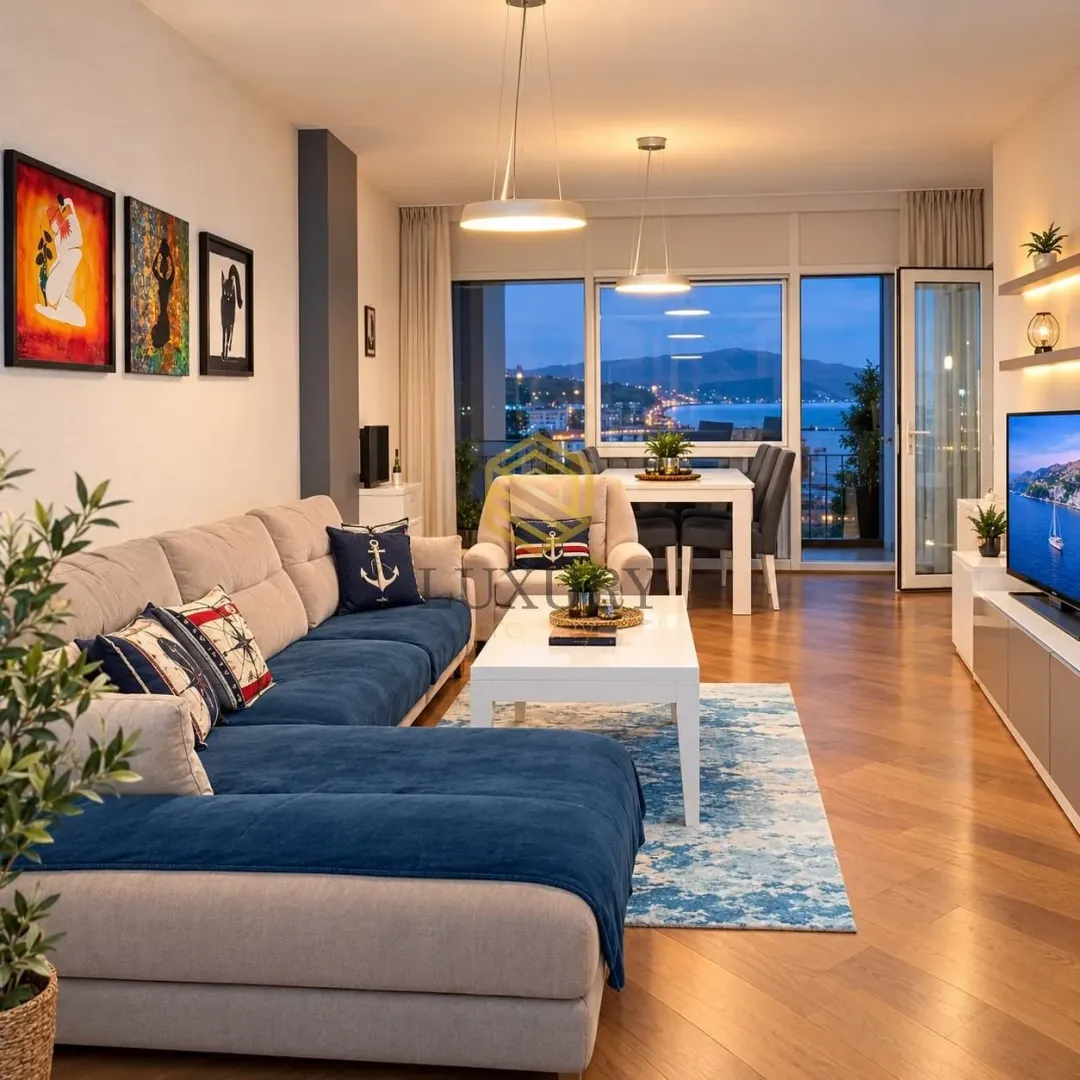 Modern living room with a sofa set and dining area in the background.