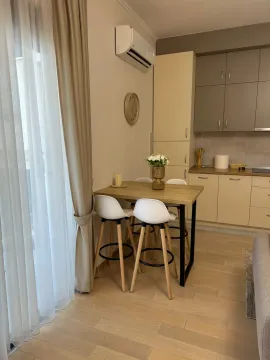 Modern kitchen with dining table and chairs. - image 3