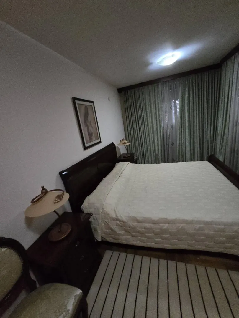 Bedroom with a double bed and nightstands.