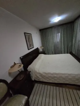 Bedroom with a double bed and nightstands. - image 12