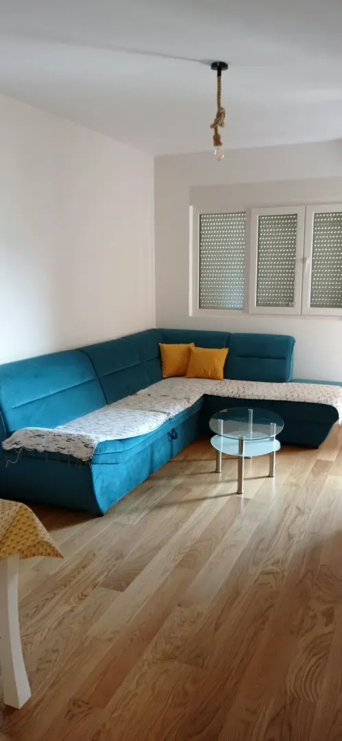 Living room with a sectional sofa and a small coffee table.
