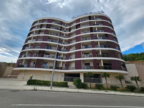 View of a modern residential building with balconies and a curved facade. - image 20