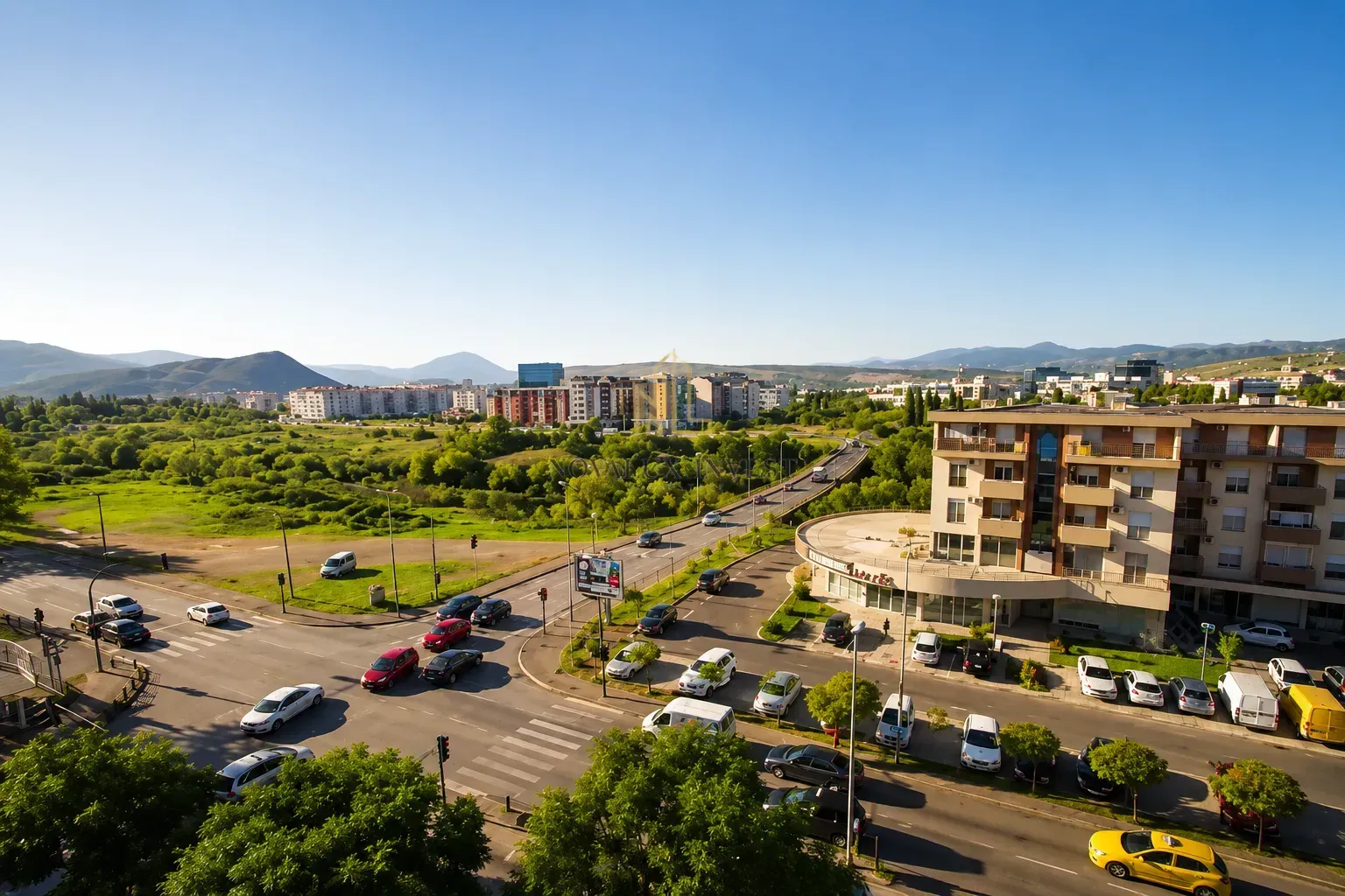 Aerial view of the urban surroundings with roads and greenery.