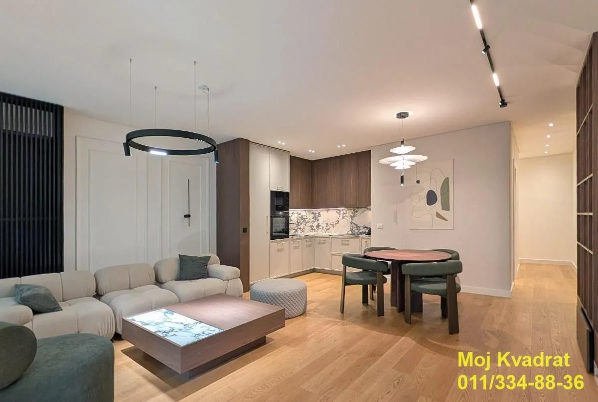 Modern living room with a dining area and an open kitchen.