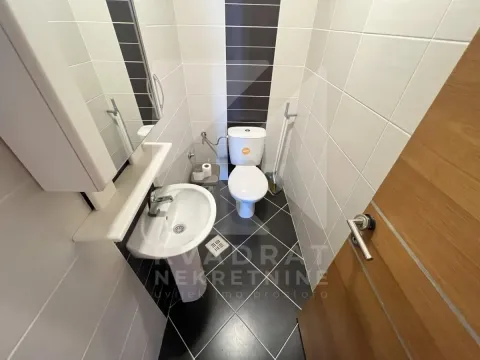 Small bathroom with washbasin, toilet bowl and tiles. - image 12