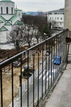 View from the balcony overlooking the city street and church. - image 9