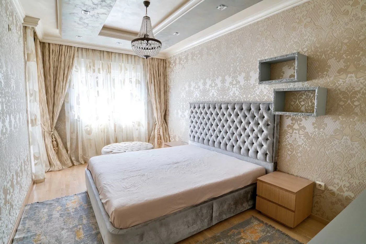 Furnished bedroom with a large double bed.