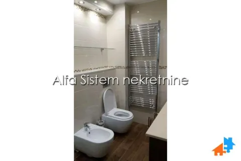 Bathroom equipped with a toilet, bidet, sink and towel radiator. - image 16