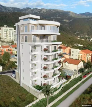 Exterior view of a modern residential building with balconies and mountain views. - image 2
